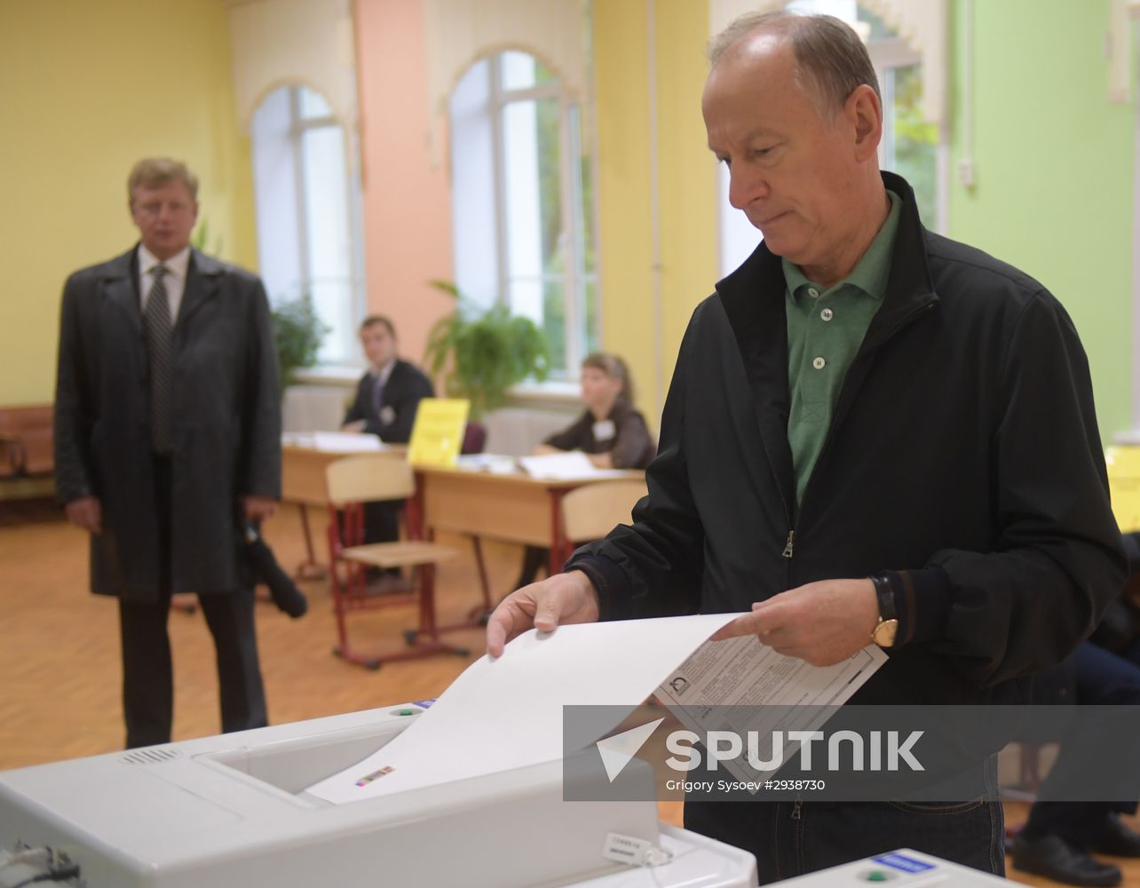 Public and political leaders vote on general election day
