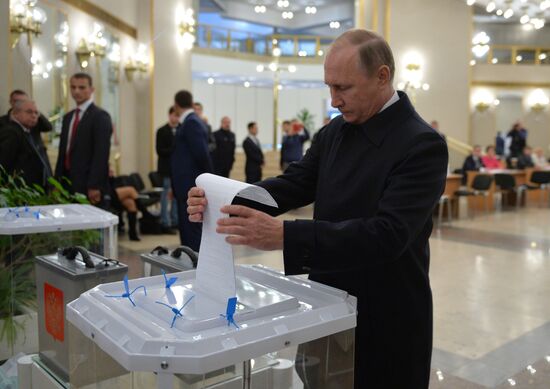 President Vladimir Putin votes on general election day