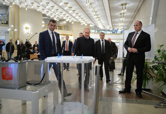 President Vladimir Putin votes on general election day