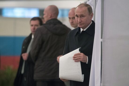 President Vladimir Putin votes on general election day