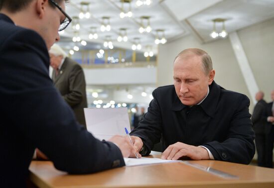 President Vladimir Putin votes on general election day