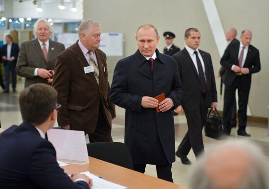 President Vladimir Putin votes on general election day