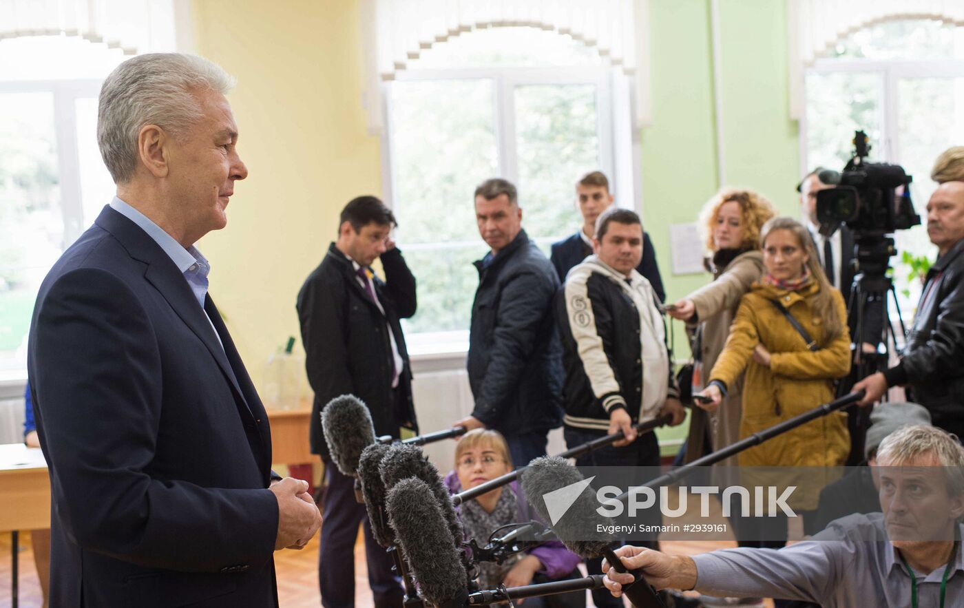Public and political leaders vote on general election day