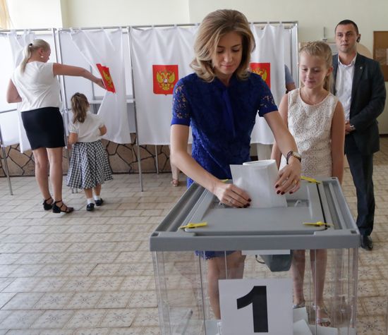Public and political leaders vote on general election day