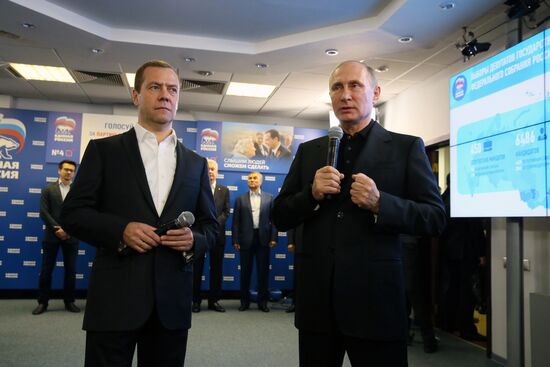 Vladimir Putin and Dmitry Medvedev visit United Russia party's election campaign headquarters