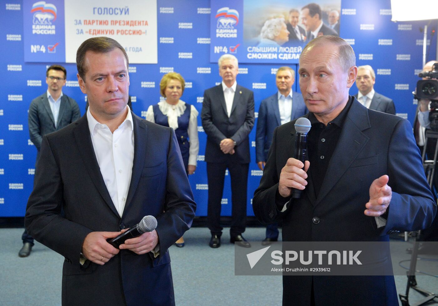 Vladimir Putin and Dmitry Medvedev visit United Russia party's election campaign headquarters