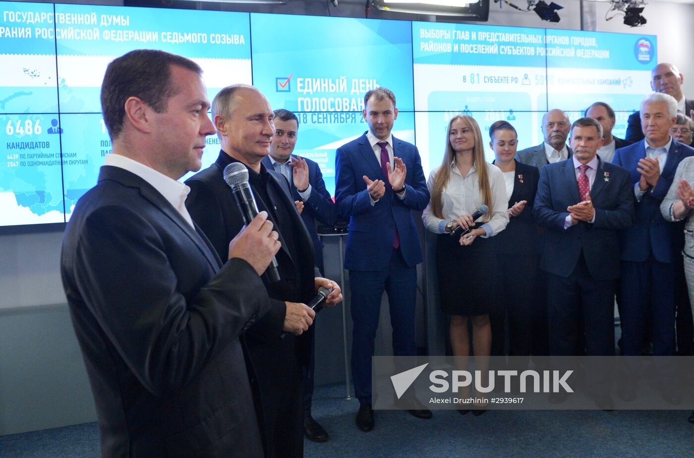 Vladimir Putin and Dmitry Medvedev visit United Russia party's election campaign headquarters