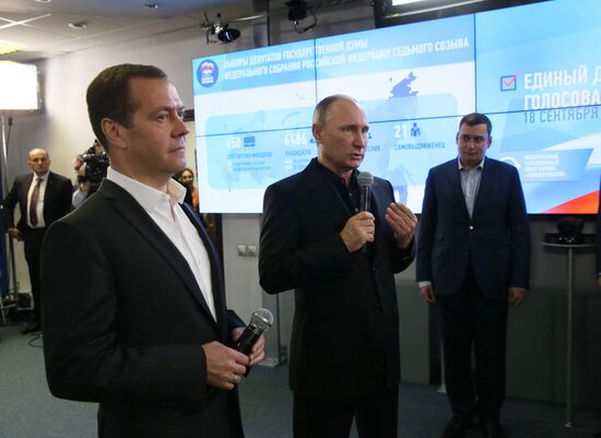Vladimir Putin and Dmitry Medvedev visit United Russia party's election campaign headquarters