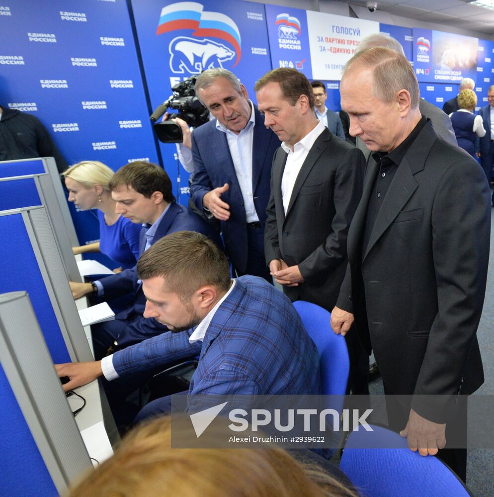 Vladimir Putin and Dmitry Medvedev visit United Russia party's election campaign headquarters