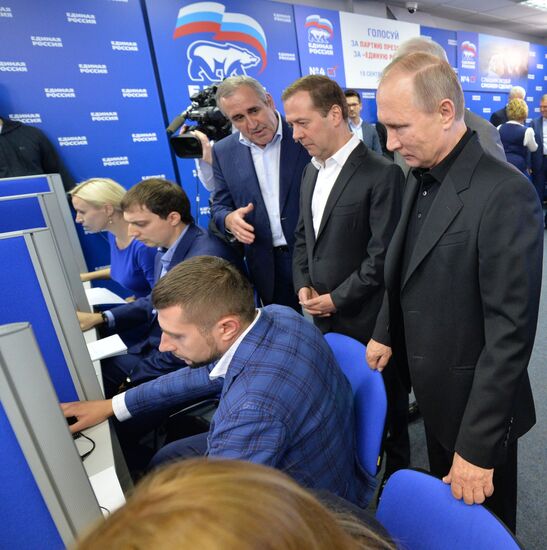 Vladimir Putin and Dmitry Medvedev visit United Russia party's election campaign headquarters