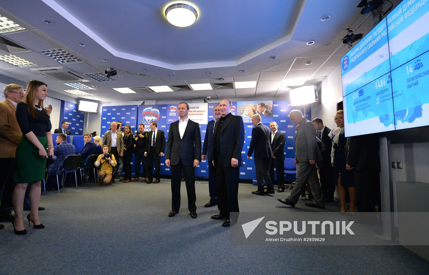 Vladimir Putin and Dmitry Medvedev visit United Russia party's election campaign headquarters