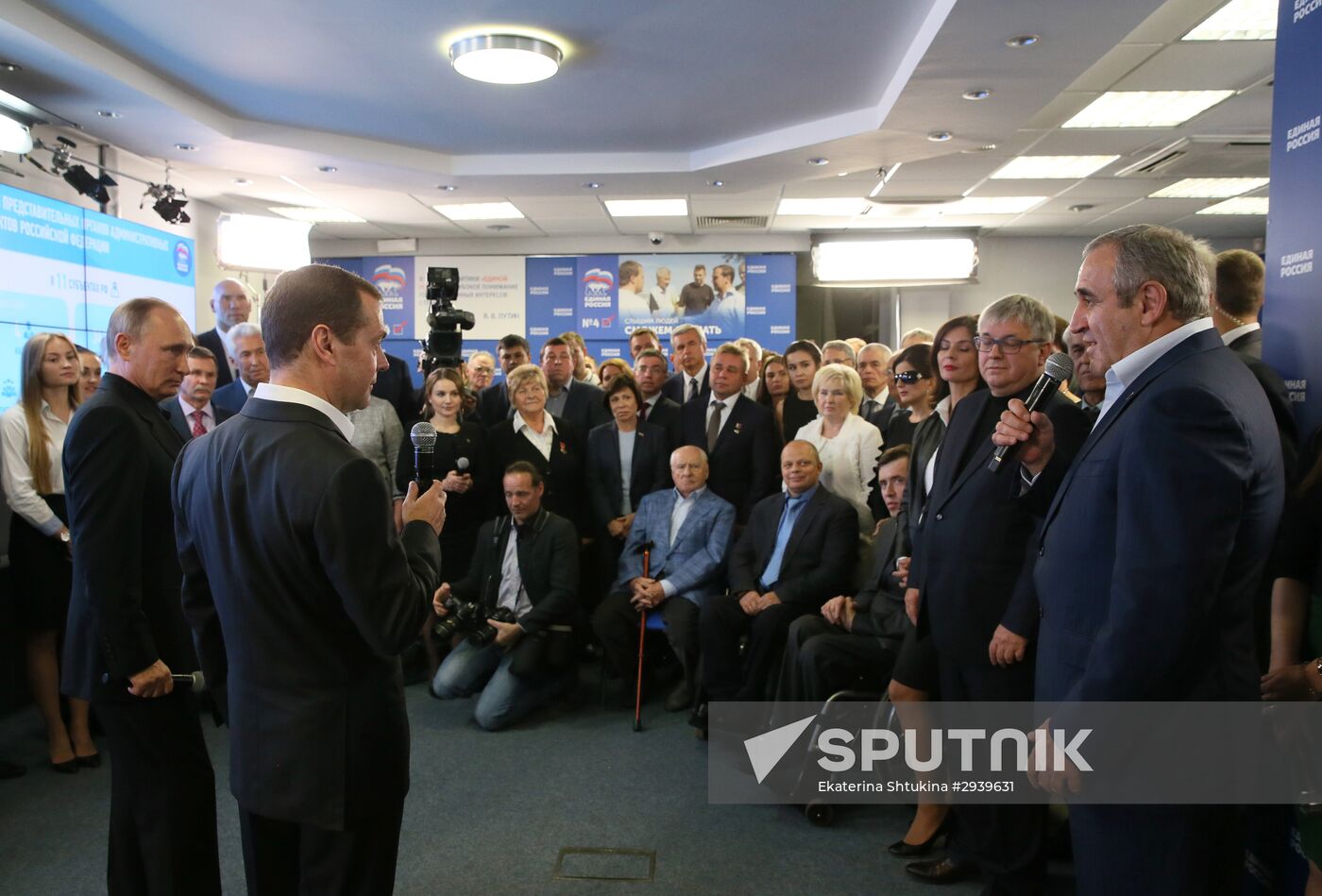 Vladimir Putin and Dmitry Medvedev visit United Russia party's election campaign headquarters