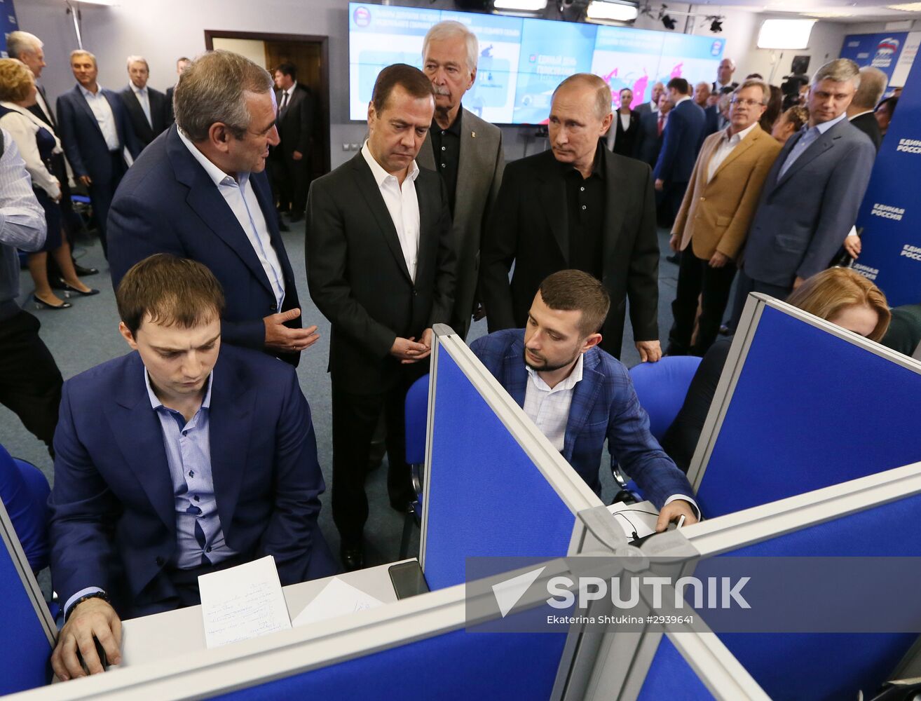 Vladimir Putin and Dmitry Medvedev visit United Russia party's election campaign headquarters