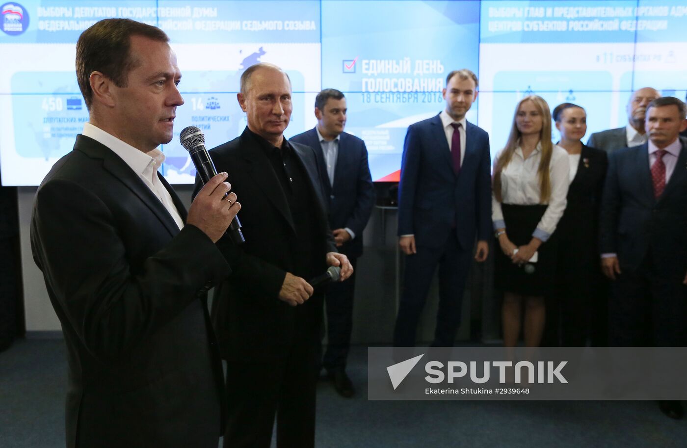 Vladimir Putin and Dmitry Medvedev visit United Russia party's election campaign headquarters