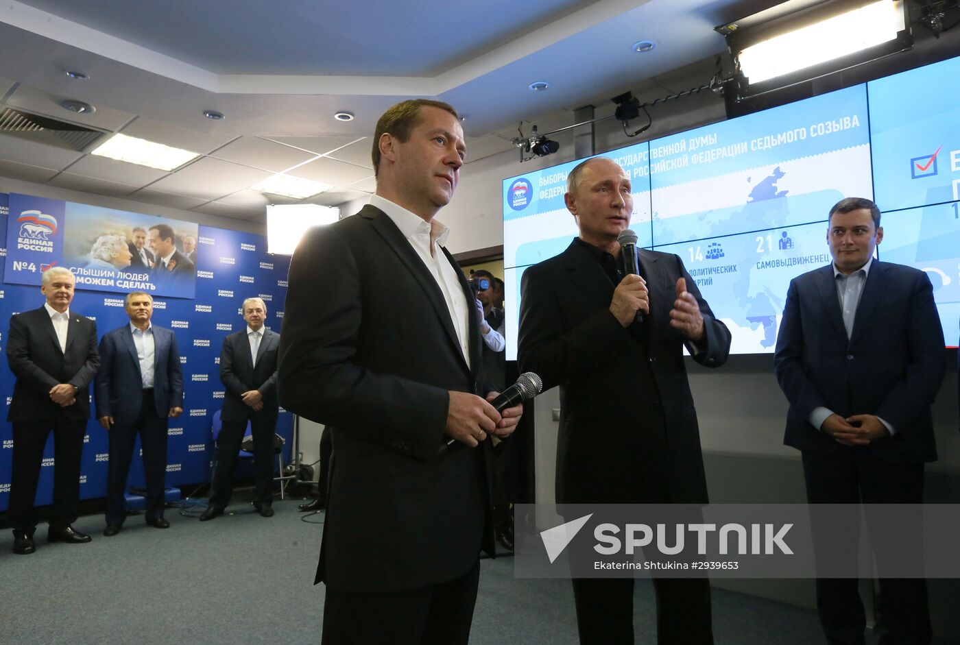 Vladimir Putin and Dmitry Medvedev visit United Russia party's election campaign headquarters
