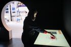 A visitor at an information screen presenting the Neptune 1 wireless water meter that sends data online, at ExpoForum ahead of the 2017 St. Petersburg International Economic Forum. Location: Russia, St. Petersburg. Author: Vladimir Astapkovich/Sputnik. SPIEF 2017 business program