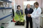 September 1, 2014. Russian President Vladimir Putin, center, visits a laboratory at the M. K. Ammosov North-Eastern Federal University in Yakutsk. Left: Yevgeniya Mikhailova, rector of the North-Eastern Federal University. Location: Russia, Yakutsk. Author: Aleksey Nikolskyi/Sputnik. Vladimir Putin visits Far Eastern Federal District