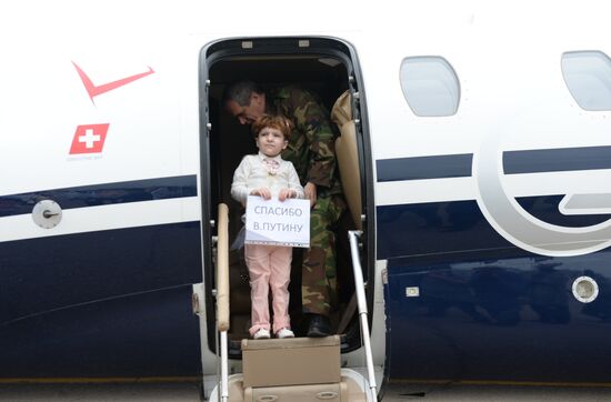 Children brought from Iraq are welcomed at Grozny airport