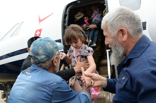 Children brought from Iraq are welcomed at Grozny airport