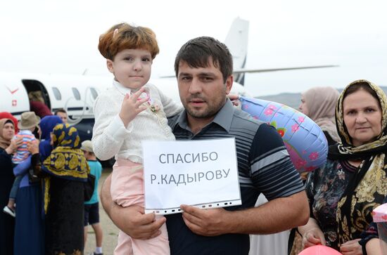 Children brought from Iraq are welcomed at Grozny airport