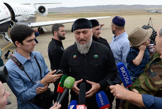 Children brought from Iraq are welcomed at Grozny airport