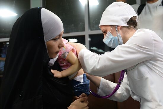 Russian children saved from Iraq arrive in Grozny