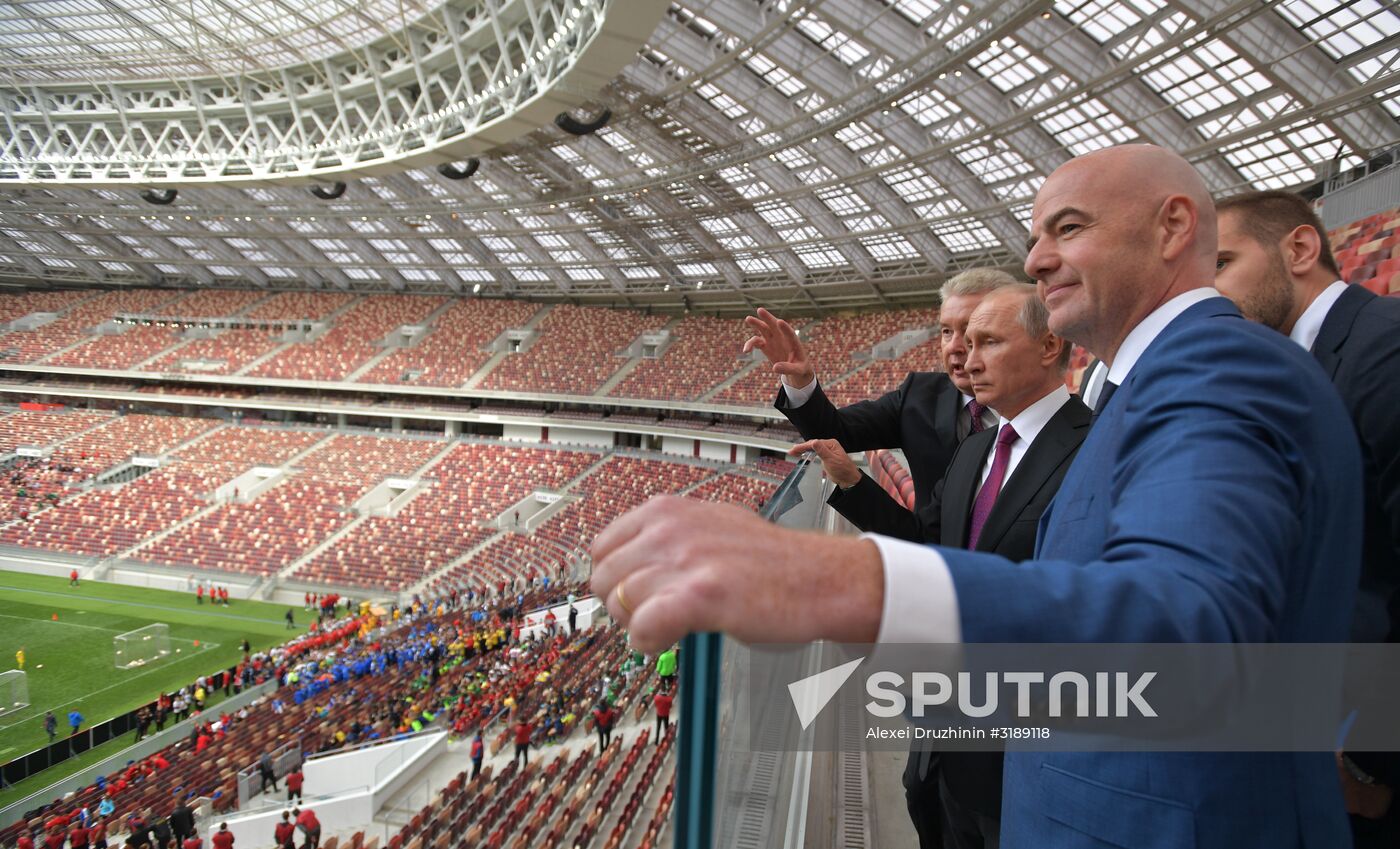 Russian President Vladimir Putin takes part in FIFA World Cup Trophy Tour kick-off ceremony in Luzhniki