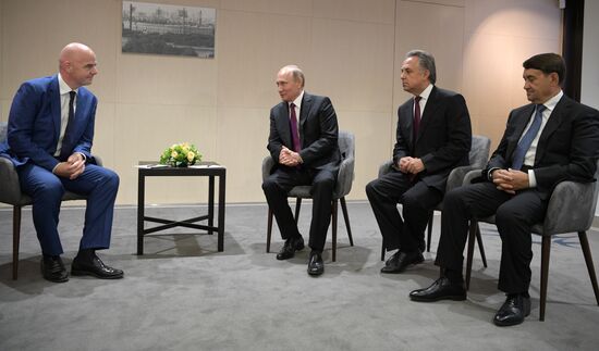 Russian President Vladimir Putin takes part in FIFA World Cup Trophy Tour kick-off ceremony in Luzhniki