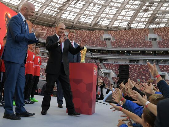 Russian President Vladimir Putin takes part in FIFA World Cup Trophy Tour kick-off ceremony in Luzhniki
