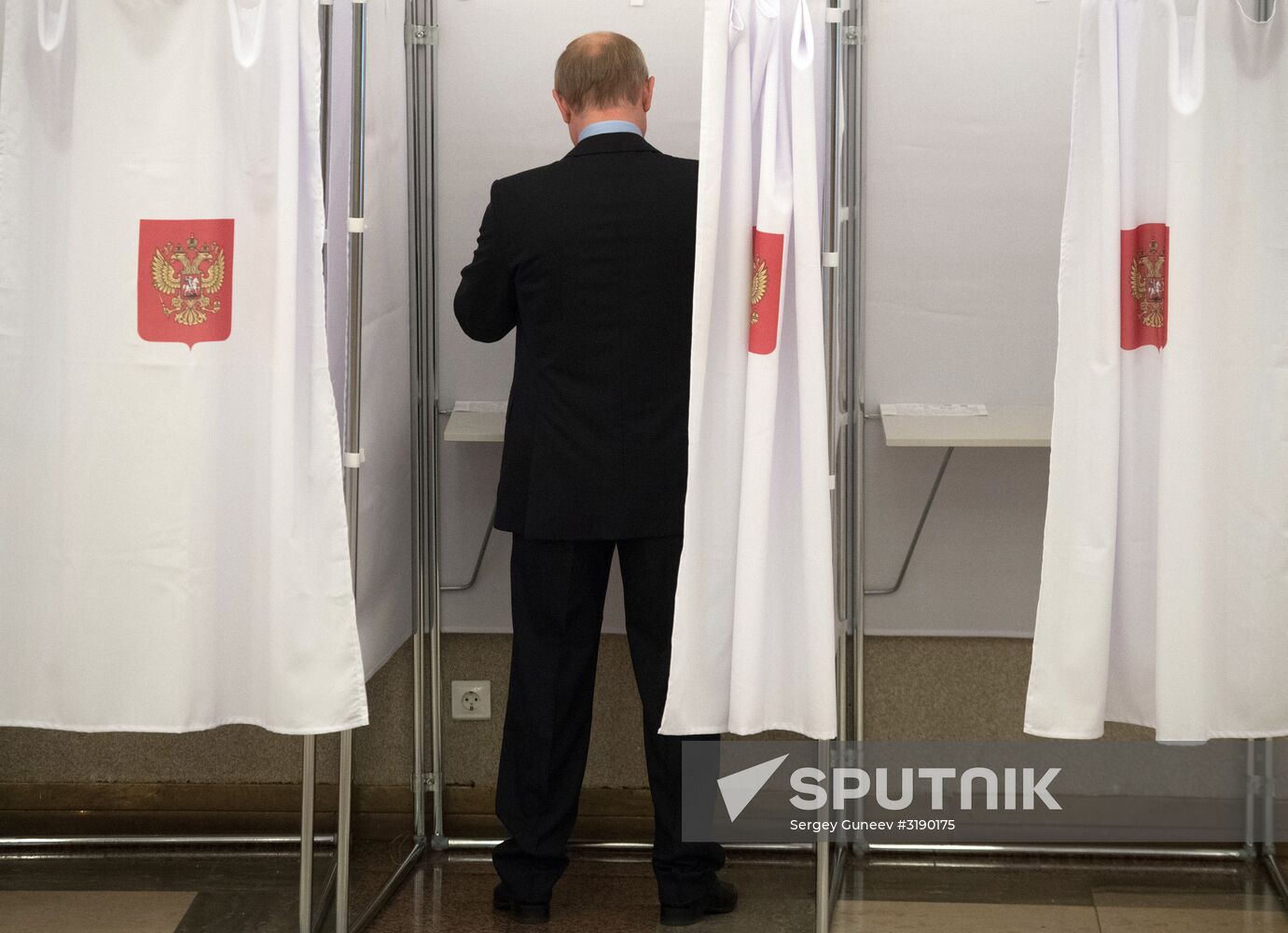 Russian President Vladimir Putin casts his vote on Unified Voting Day
