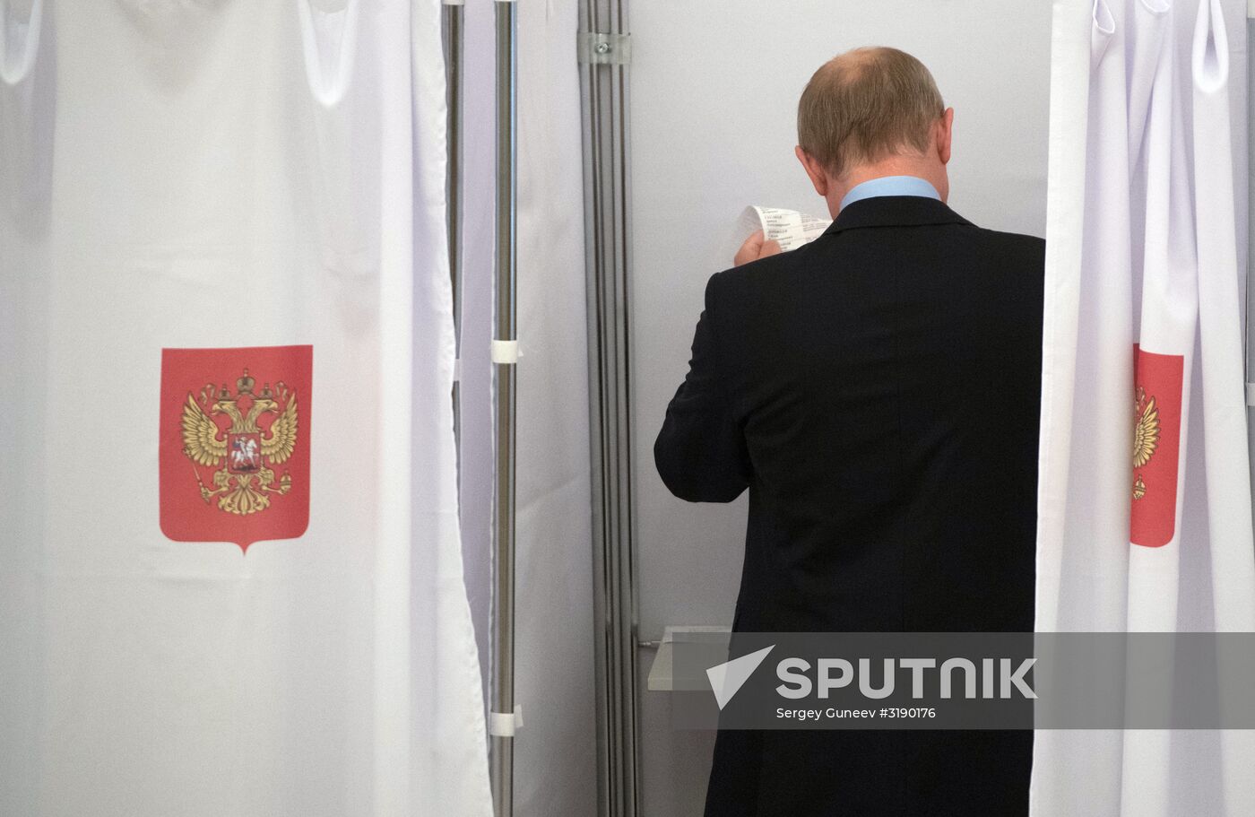 Russian President Vladimir Putin casts his vote on Unified Voting Day