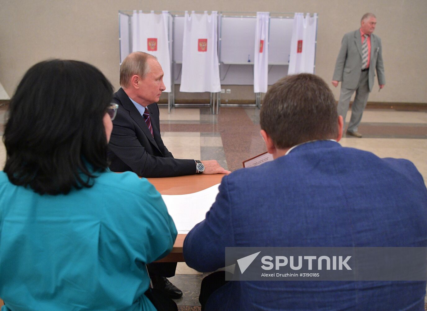 Russian President Vladimir Putin casts his vote on Unified Voting Day