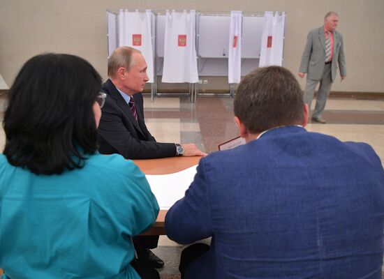Russian President Vladimir Putin casts his vote on Unified Voting Day
