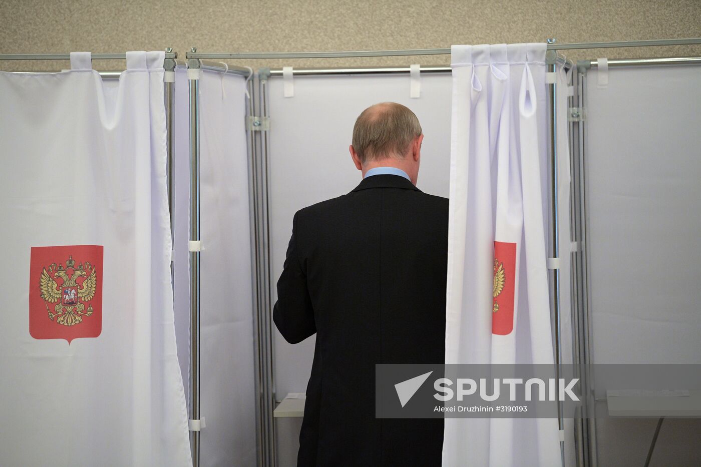 Russian President Vladimir Putin casts his vote on Unified Voting Day