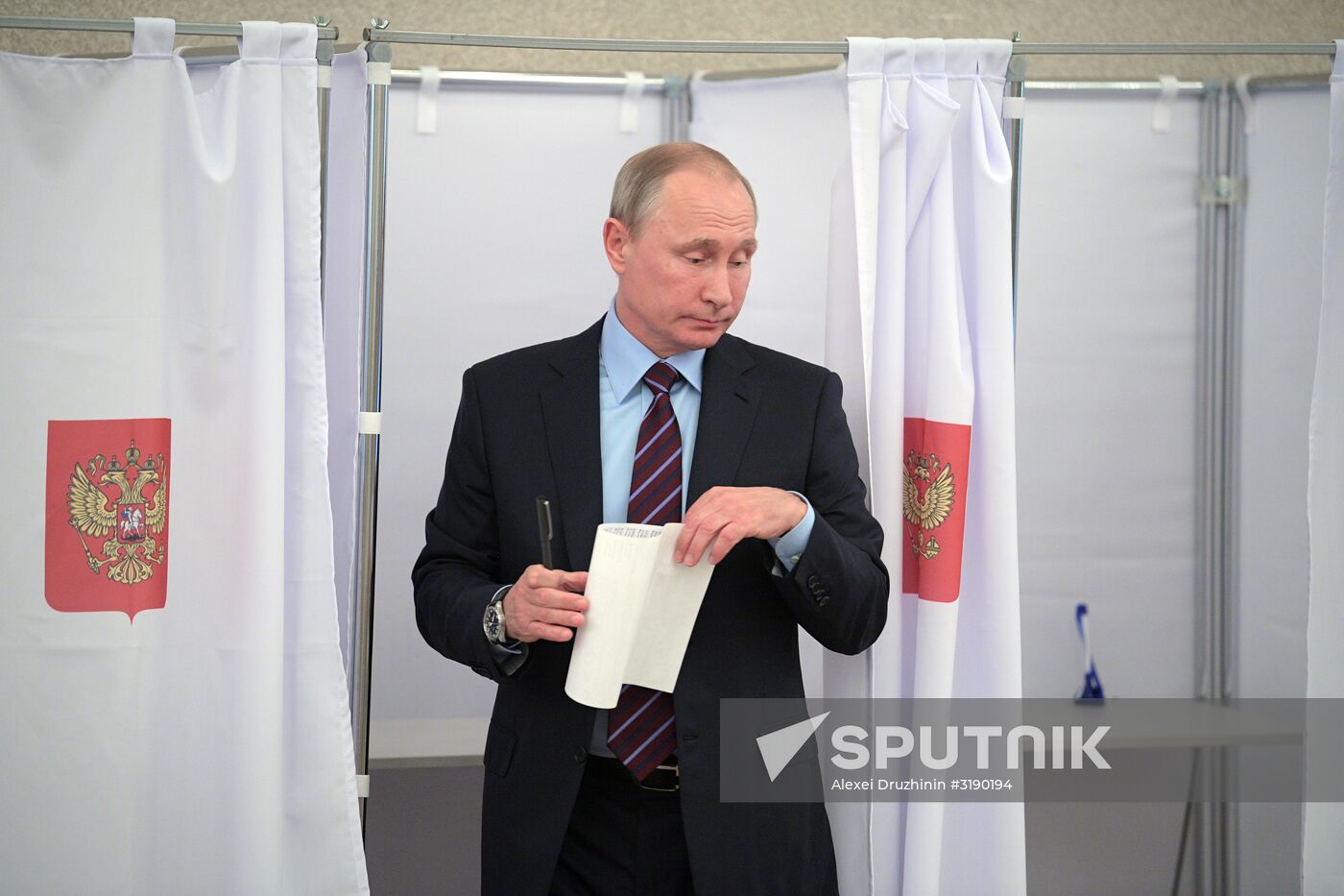 Russian President Vladimir Putin casts his vote on Unified Voting Day