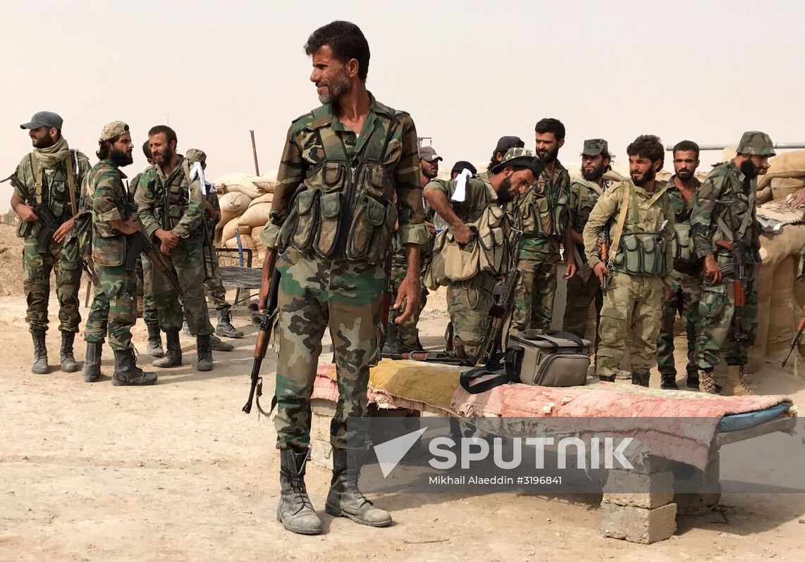 Syrian army and people's militia during offensive operation near al-Jafra in Deir-ez-Zor