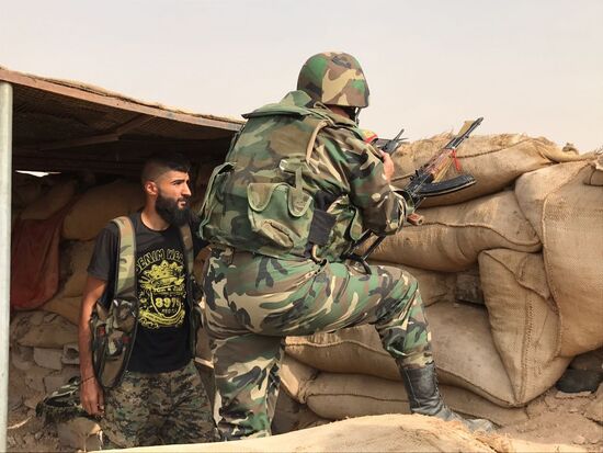 Syrian army and people's militia during offensive operation near al-Jafra in Deir-ez-Zor