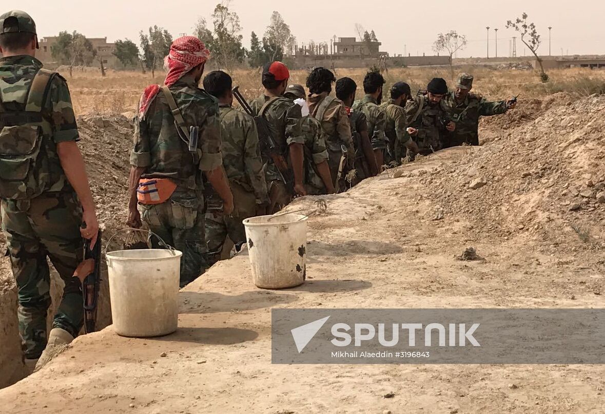 Syrian army and people's militia during offensive operation near al-Jafra in Deir-ez-Zor