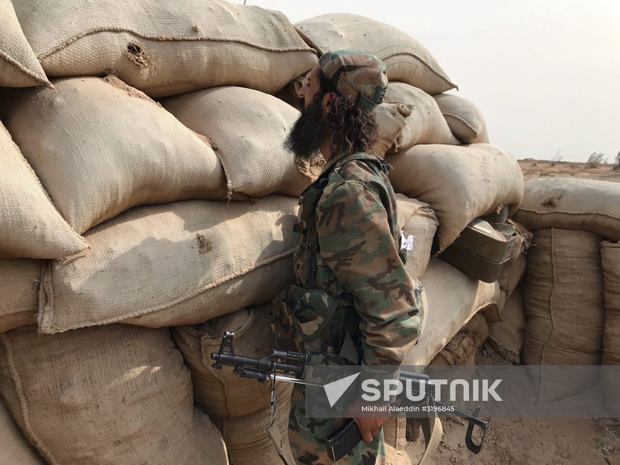 Syrian army and people's militia during offensive operation near al-Jafra in Deir-ez-Zor