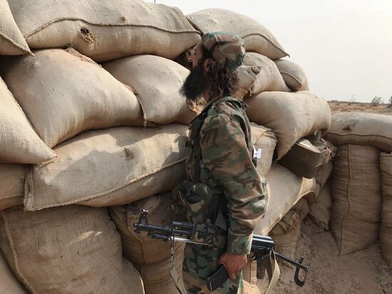 Syrian army and people's militia during offensive operation near al-Jafra in Deir-ez-Zor