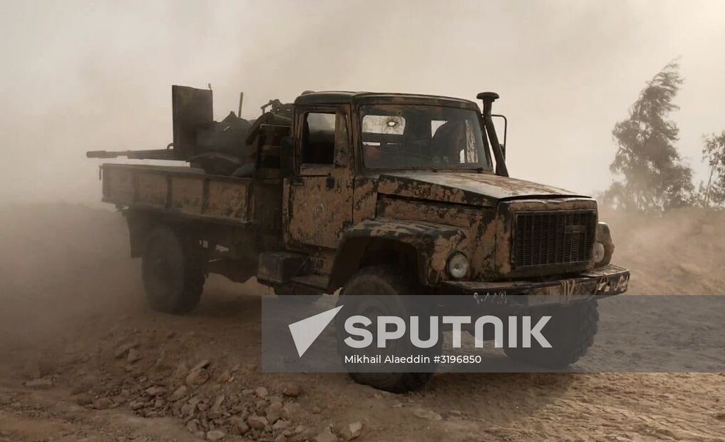 Syrian army and people's militia during offensive operation near al-Jafra in Deir-ez-Zor