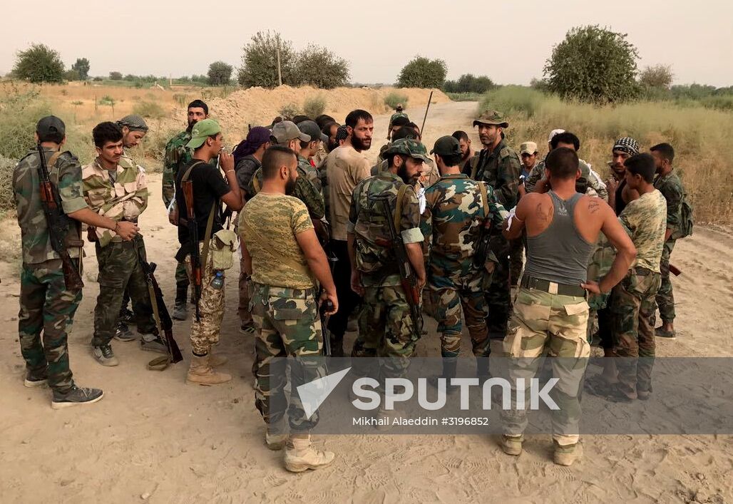 Syrian army and people's militia during offensive operation near al-Jafra in Deir-ez-Zor