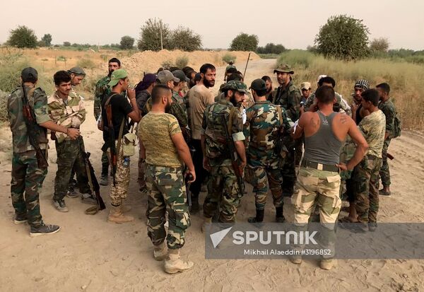 Syrian army and people's militia during offensive operation near al-Jafra in Deir-ez-Zor
