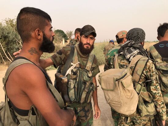 Syrian army and people's militia during offensive operation near al-Jafra in Deir-ez-Zor