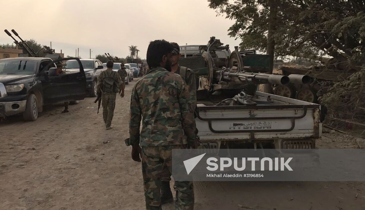 Syrian army and people's militia during offensive operation near al-Jafra in Deir-ez-Zor