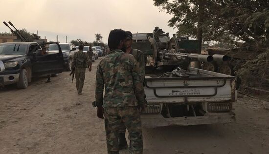 Syrian army and people's militia during offensive operation near al-Jafra in Deir-ez-Zor