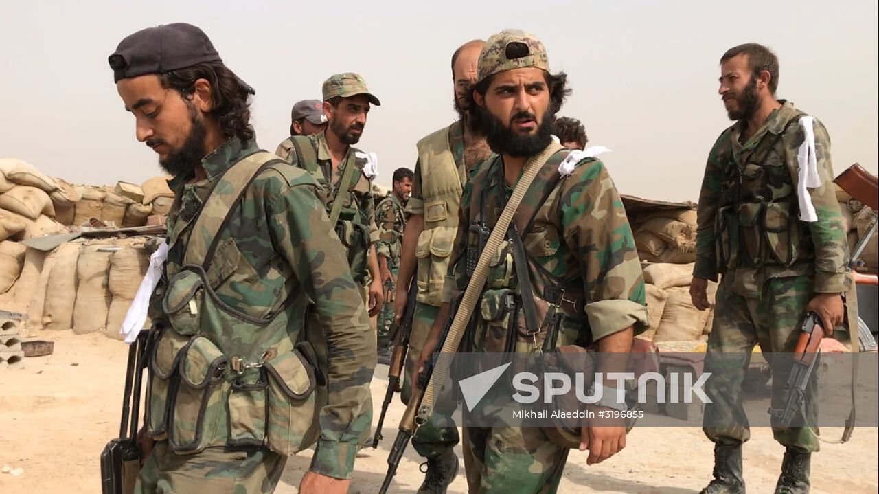 Syrian army and people's militia during offensive operation near al-Jafra in Deir-ez-Zor