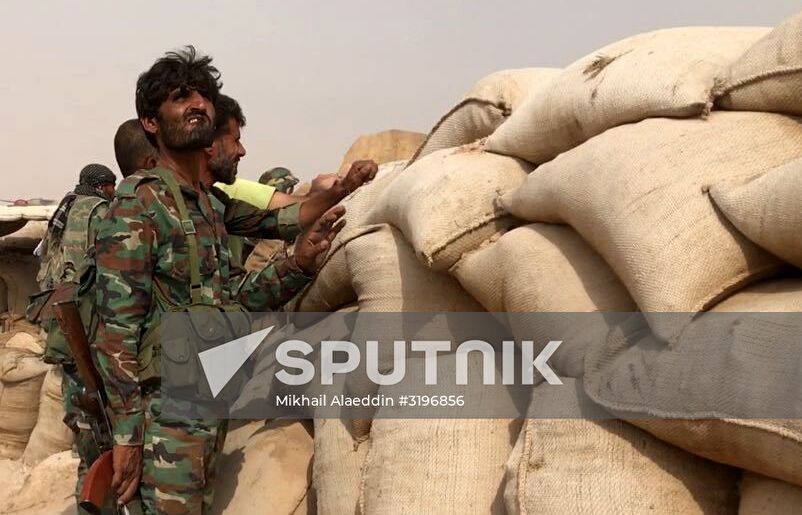 Syrian army and people's militia during offensive operation near al-Jafra in Deir-ez-Zor