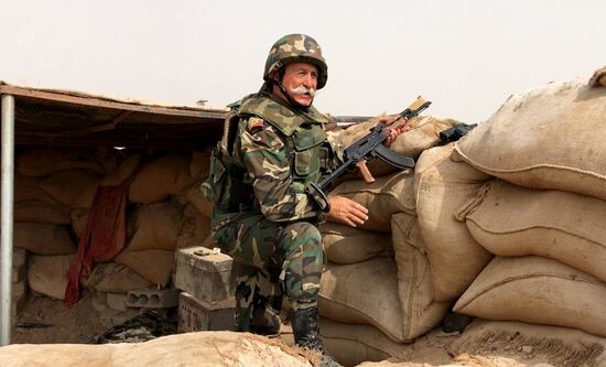 Syrian army and people's militia during offensive operation near al-Jafra in Deir-ez-Zor