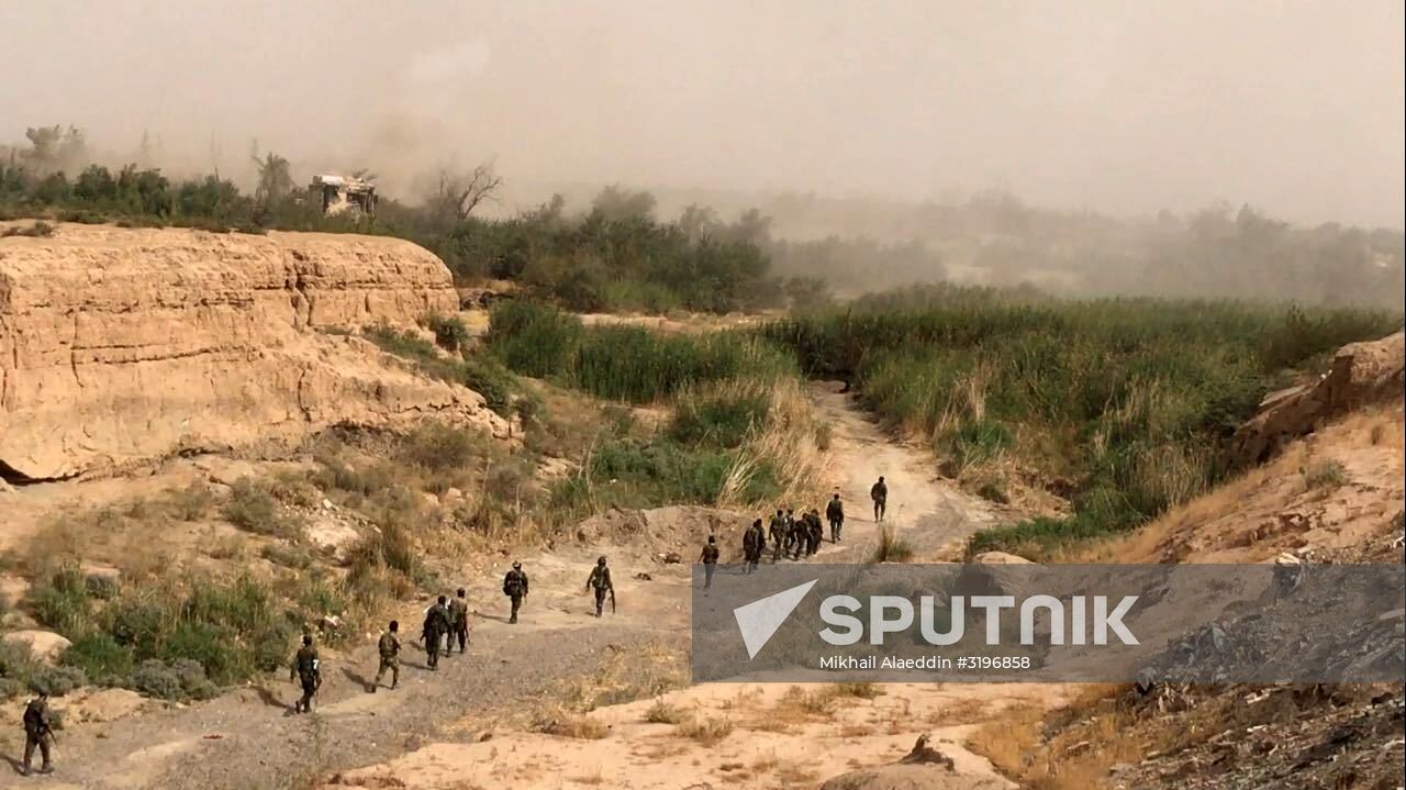 Syrian army and people's militia during offensive operation near al-Jafra in Deir-ez-Zor